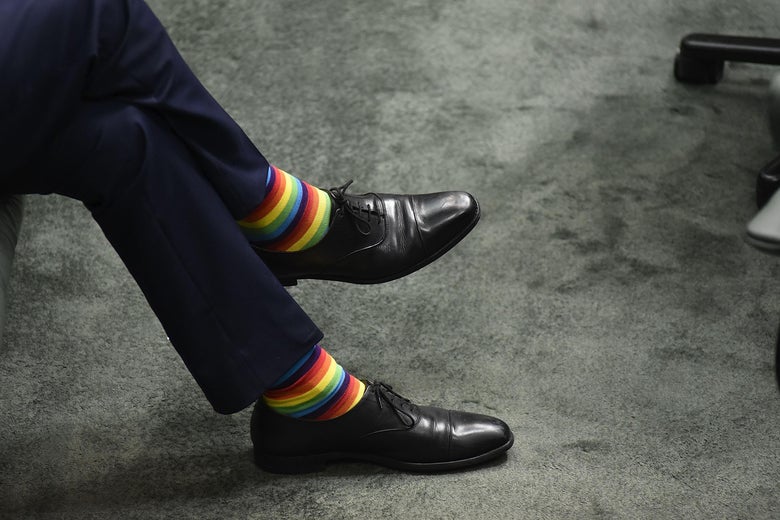 Man wearing rainbow socks.